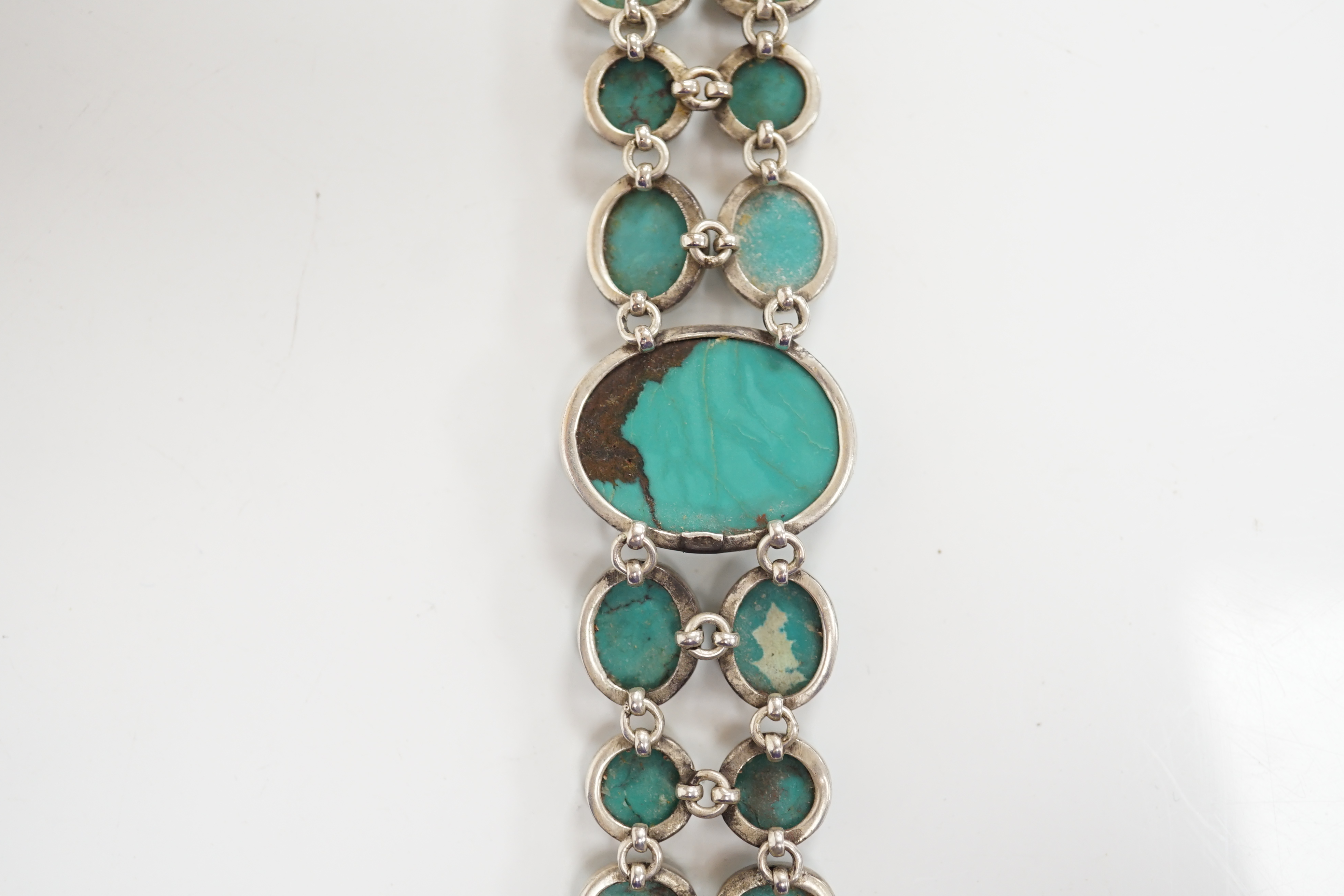 A modern silver and two row turquoise cluster set bracelet, overall 22cm. Condition - good